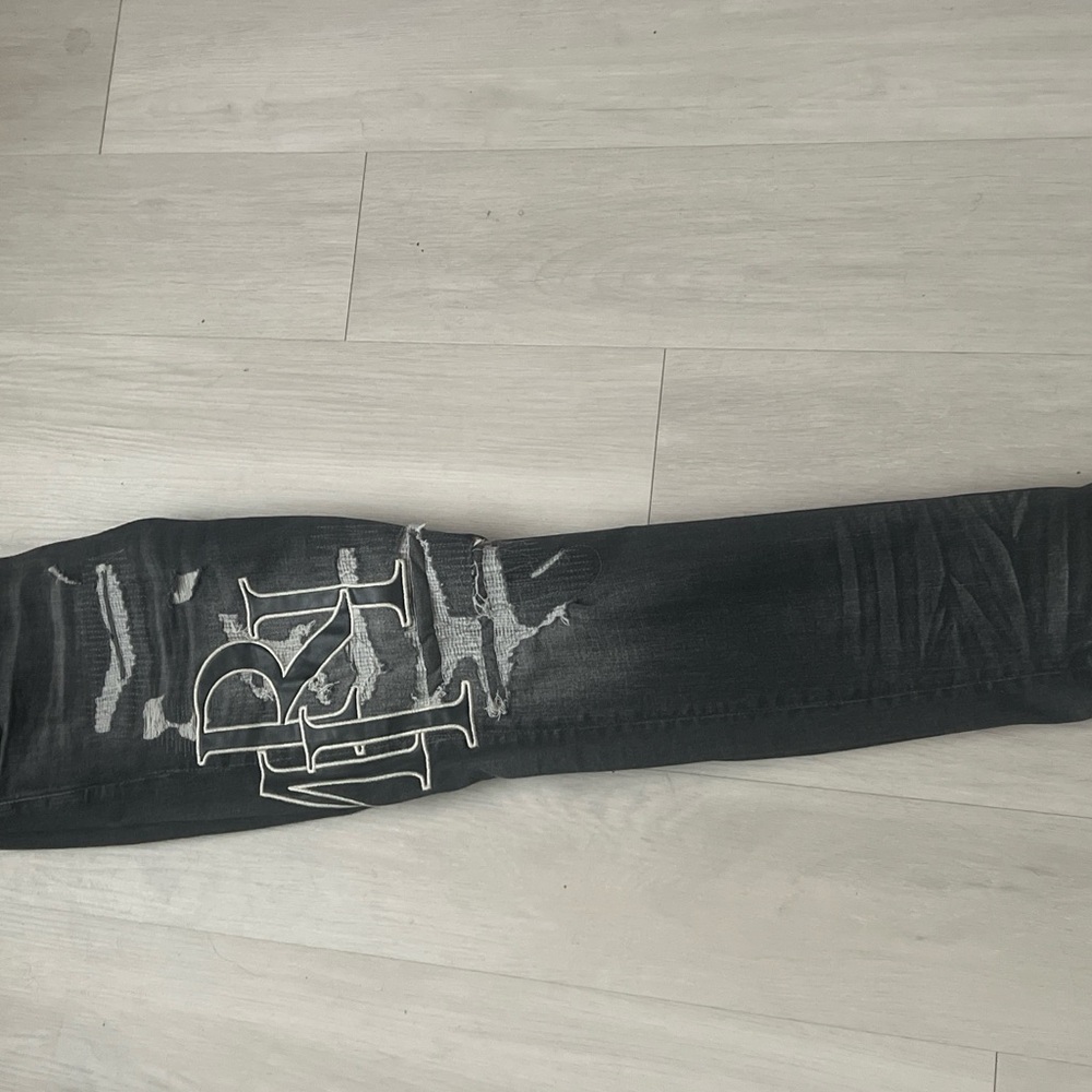 AMIRI Black Distressed Skinny Jeans